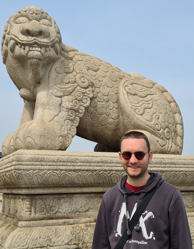 photo of T. Delcroix next to a Haechi from Gyeongbokgung Palace in Seoul